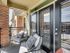 Spacious patio with two large outdoor lounge chairs.