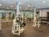 The Henry Apartments, interior, fitness center, weight machines, large mirrors, spacious
