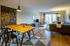 The Henry Apartments, interior, dining room living room, table, chairs, area rugs, tv, sectional sofa, large sliding glass doors
