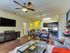 Beautiful open kitchen. Custom kitchen Cabinets, designer tile backsplash Stainless steel GE appliance package, Premium quartz counter tops. Spacious Living Room. Open concept floor plan, with natural light. Ceiling fan and faux wood floor