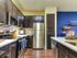 Beautiful open kitchen. Custom kitchen Cabinets, designer tile backsplash Stainless steel GE appliance package, Premium quartz countertops