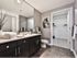Spacious master bathroom with ceramic tile flooring