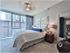 Spacious, fully furnished master bedroom with walk-in closet