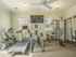Fitness Center with stationary bike, treadmill, elliptical, and universal weight machine