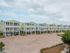 Exterior shot of community with several apartment buildings