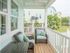 Back porch with seating and outdoor ceiling fan