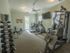 Fitness center equipment with free weights and rowing machine
