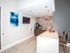 Coffee area with two chairs alongside a kitchen bar area in resident lounge l High Ridge Landing