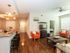 Living room with wood-style floors and ceiling fan l High Ridge Landing
