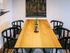The Henry Apartments, interior, dining room, large table for four, wood floor, area rug, wall art