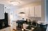 The Henry Apartments, interior, kitchen, white cabinets, stainless steel appliances, refrigerator, gas stove/oven, dark counter top, wood floor, natural light