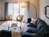 The Henry Apartments, interior, living room, sectional sofa, area rug, wood floor, sliding glass doors