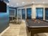 The Henry Apartments, interior, large windows, billiard table, table seating, wall mounted tv, wood floor