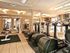 A gym is filled with equipment |  Mirrors line the walls |  Mirasol at Celebration