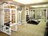 A gym is filled with weights and equipment |  Mirrors line the walls |  Mirasol at Celebration