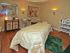 Mirasol spa room | Comfortable massage table | various shelves are lined with lotions and oils |  Mirasol at Celebration