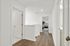 Hallway leading to primary bedroom
