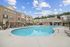 Swimming pool with lounge chairs.