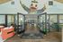 Inviting entryway at Ducks Village with open glass doors and comfortable seating.
