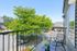 Charming balcony view with seating and greenery, perfect for relaxation.