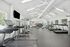 Bright and spacious modern fitness center with state-of-the-art equipment, including treadmills and weight machines.