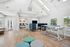 Bright and modern communal lounge area with stylish seating, natural light, and efficient workspace options.