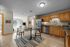 Bright and inviting open-plan kitchen and dining area with modern appliances and cozy living space.