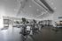 Modern and spacious gym with state-of-the-art exercise equipment and bright natural lighting.