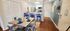 Inviting open-concept kitchen and dining area featuring modern appliances, stylish bar seating, and a cozy dining table with elegant table settings.