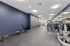 Modern fitness center featuring state-of-the-art exercise equipment with sleek design and vibrant atmosphere.
