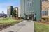 Inviting leasing office entrance with modern architectural design, surrounded by well-maintained landscaping.