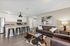 Chic open-plan living area with contemporary kitchen and stylish lounge set featuring modern decor and elegant finishes.