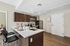 Modern kitchen with sleek countertops, stainless steel appliances, and stylish cabinetry, ideal for contemporary living.