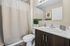 Modern bathroom with elegant fixtures, stylish vanity, and contemporary decor.
