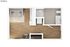 Birdseye view of a modern studio apartment floor plan featuring an open living area and compact bathroom.