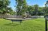 Vibrant outdoor playground with modern equipment surrounded by lush greenery, ideal for family-friendly living.
