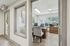 Bright and modern office space with sleek desk, comfortable seating, and large windows for natural light.