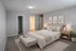 Elegant master bedroom with soft gray tones, a cozy double bed, chic decor, and warm lighting creating a tranquil retreat.