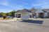 Charming apartment community with spacious parking and a convenient mailbox pavilion, surrounded by lush greenery and modern architecture.