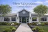 Charming residential building with modern upgrades, enhanced landscaping, and welcoming facade, indicating exciting new renovations coming soon.