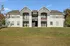 Attractive apartment complex showcasing modern architecture, manicured lawns, and charming balconies for outdoor relaxation.
