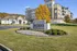 Elegant apartment complex 'The Overlook at Ashland' featuring a modern design nestled amidst lush greenery and vibrant autumn foliage.