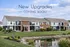 Inviting apartment complex showcasing modern design and lush landscaping with a serene pond view and promise of exciting new upgrades coming soon.