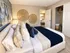 Elevate 311 Apartments - Cozy Bedroom