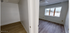 Bright apartment featuring two rooms with stylish hardwood flooring, a large sunlit window, and spacious walls, located in Fort Fairfield.