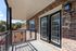 Charming apartment balcony with elegant brickwork and decorative railing, perfect for enjoying peaceful outdoor moments.