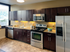 Apartments for Rent in Pittsburgh, PA - Apartments at River View - Kitchen with Tile Flooring, Dark Brown Cabinets, Stainless Steel Appliances, and Granite Countertops