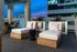 Stylish lounge chairs on Riva's rooftop deck