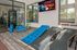 Inviting fitness center featuring modern fitness equipment and vibrant exercise mats, perfect for an energizing workout.