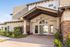 Leasing Office entrance with modern architecture and lush landscaping